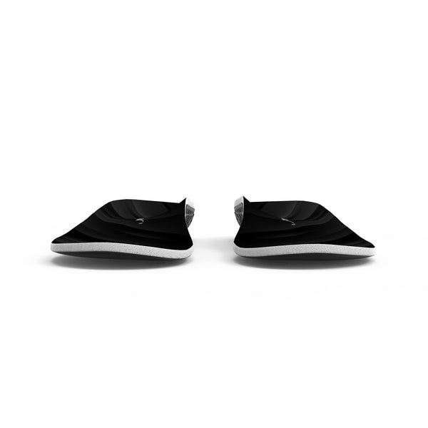 Plush insoles in black, a pair angled toward the camera